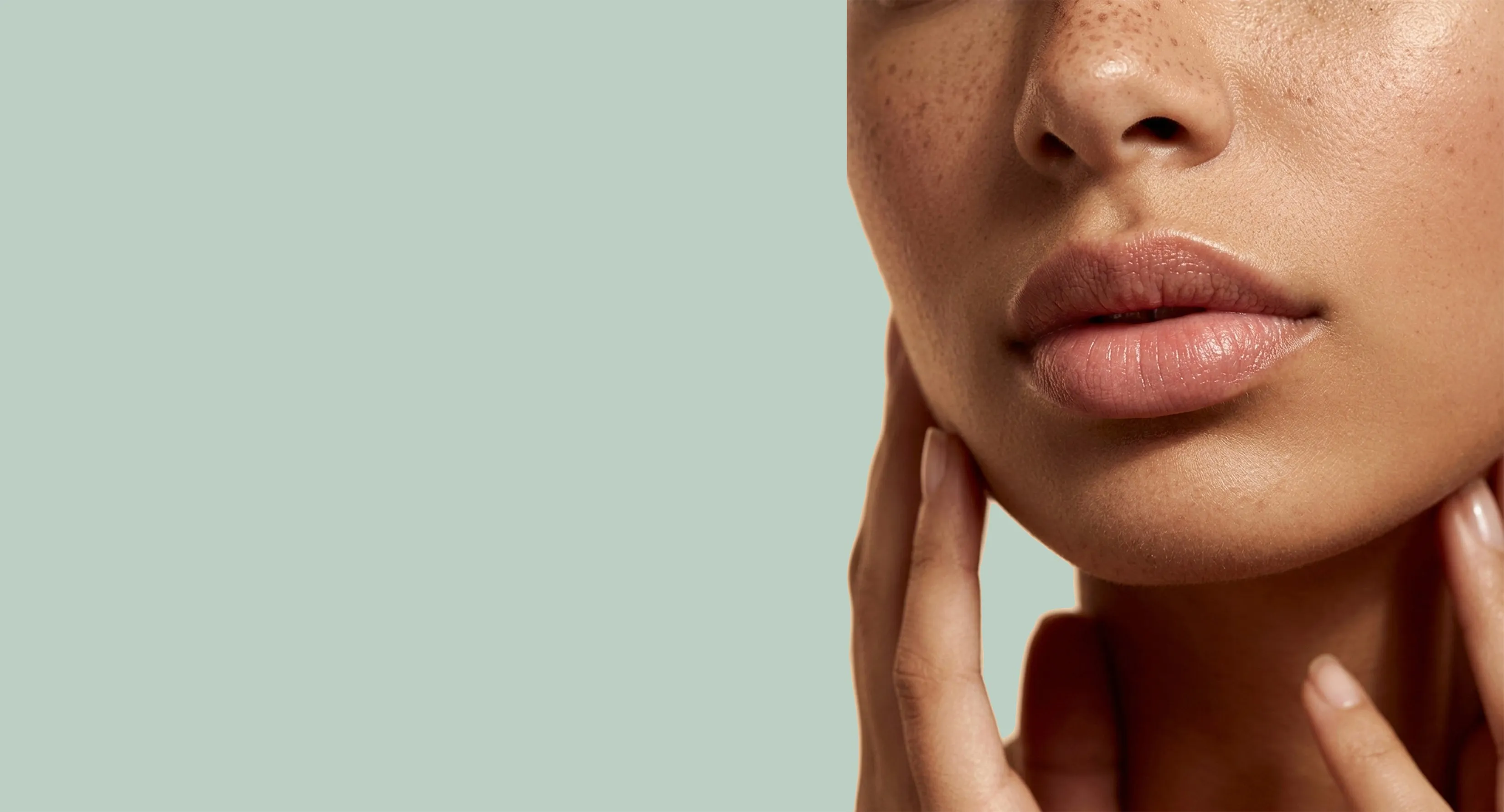 First Dose Cosmetics seal beside a close-up portrait on sage green.